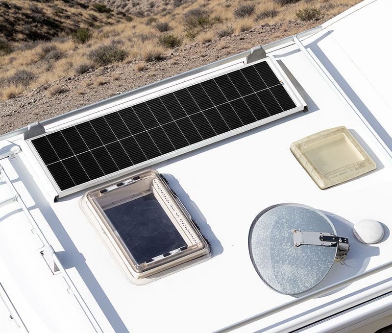 Rich Solar 130W slim solar panel mounted on RV roof beside vents and roof accessories