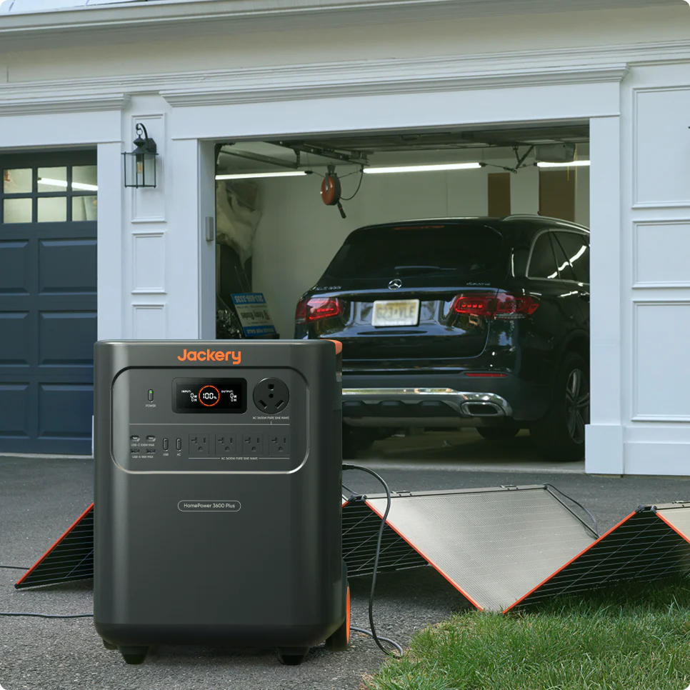 Jackery HomePower 3600 Plus solar charging setup outside a garage
